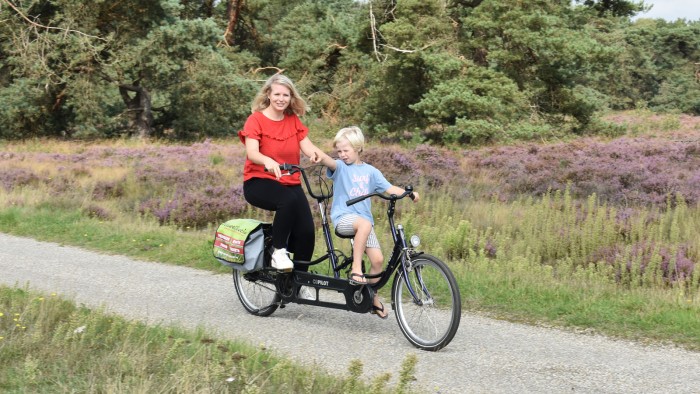 Parent-child tandem on the Veluwe in 