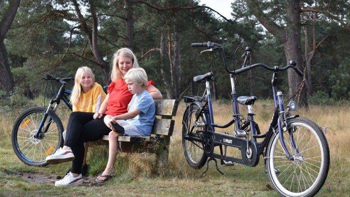 Parent-child tandem on the Veluwe in 